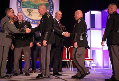 Ohio State Patrol troopers accept the •	Distinguished Law Enforcement Valor Award at the 2019 Law Enforcement Conference.