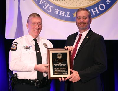Officer Kenneth Lawson, of the Columbus Division of Police, accepts the Mark Losey Distinguished Law Enforcement Service Award at the 2019 Law Enforcement Conference.