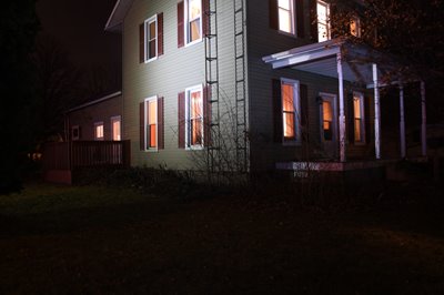 A photo of the home where Harley Dilly's body was found shows the rigid TV antenna he climbed to the roof.