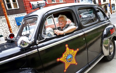 Special Deputy Howard Mullen of the Meigs County Sheriff’s Office shows off his 1947 Ford.